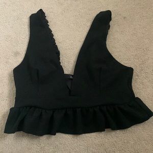 Black cropped tank top with ruffle bottom